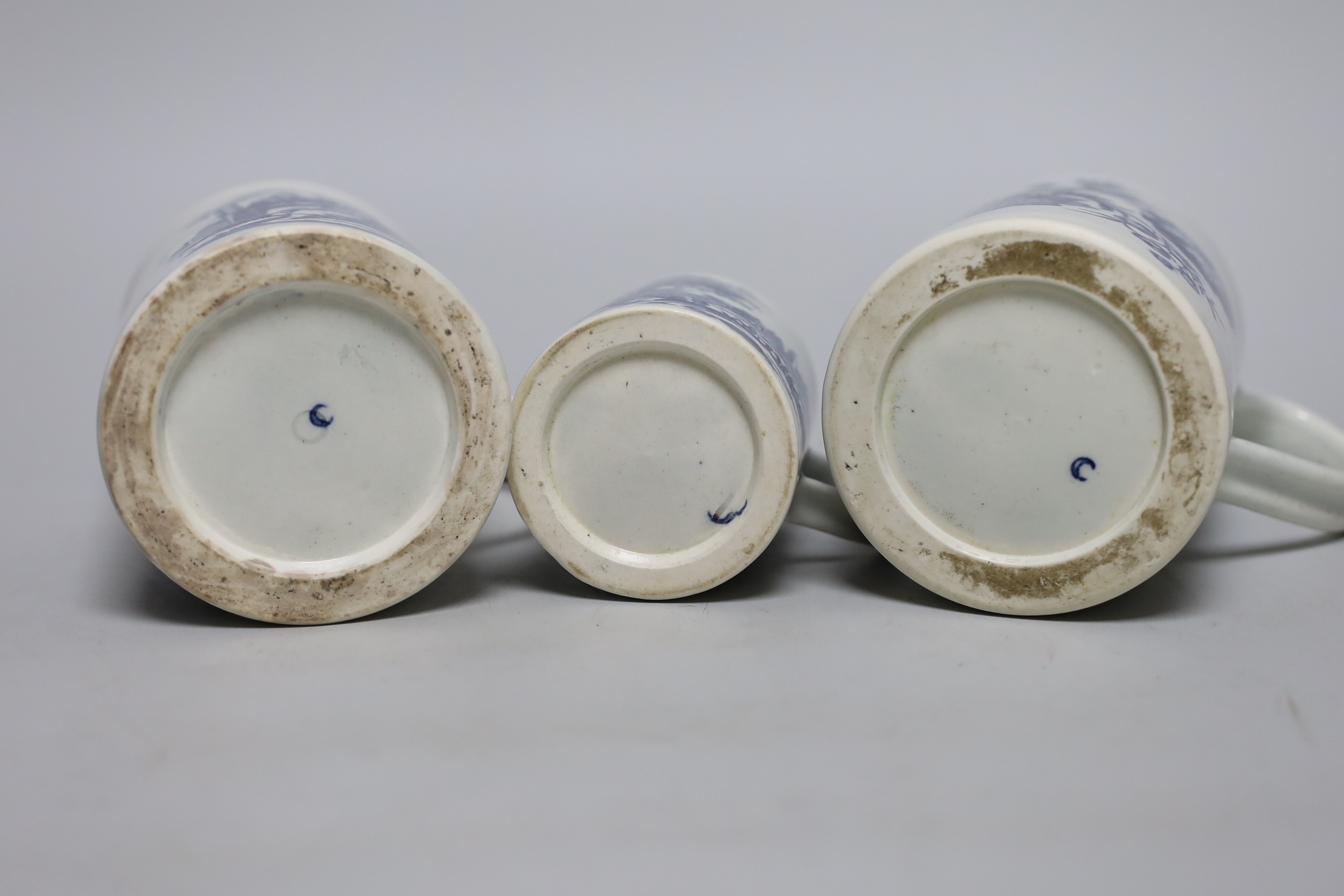 Three 18th century Worcester mugs, Three flowers, La Promenade, 12.5cms high